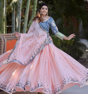 Peach Colored Partywear Embroidered Silk Lehenga Choli